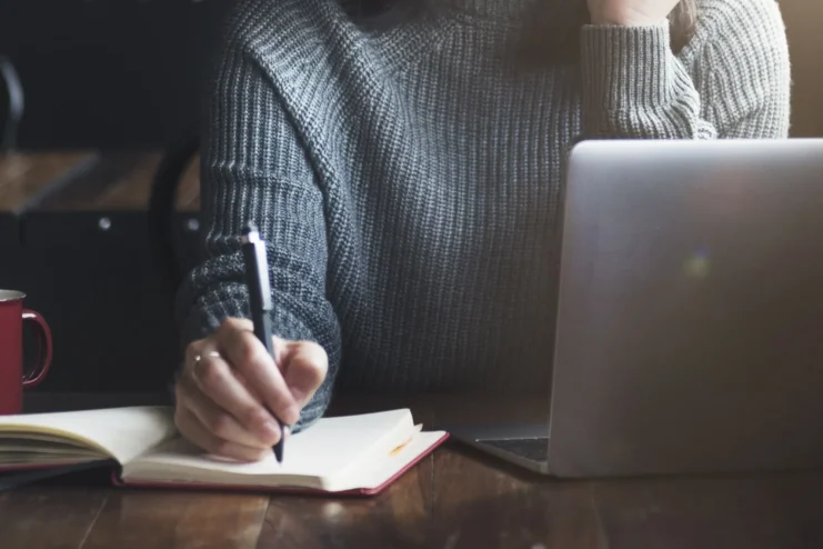 woman writing book